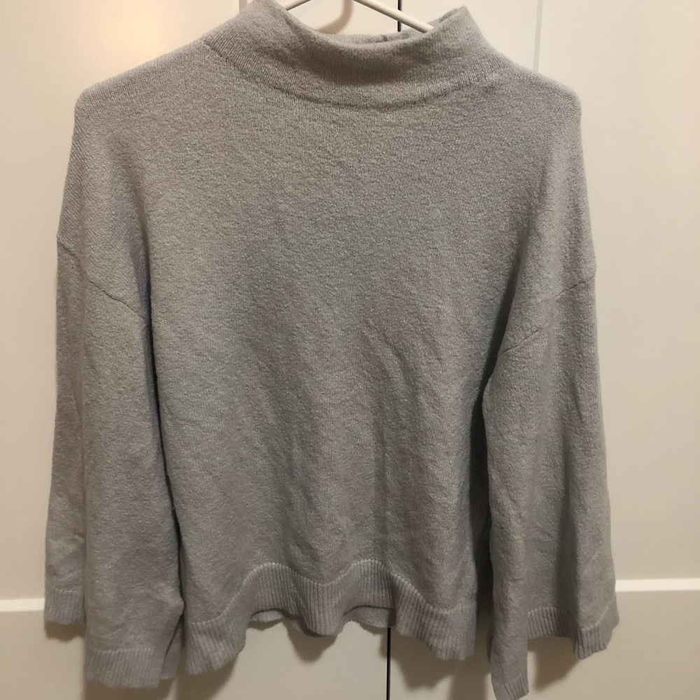Greyish-light blue sweater